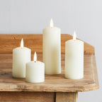 4 TruGlow® Ivory Slim Pillar Candles